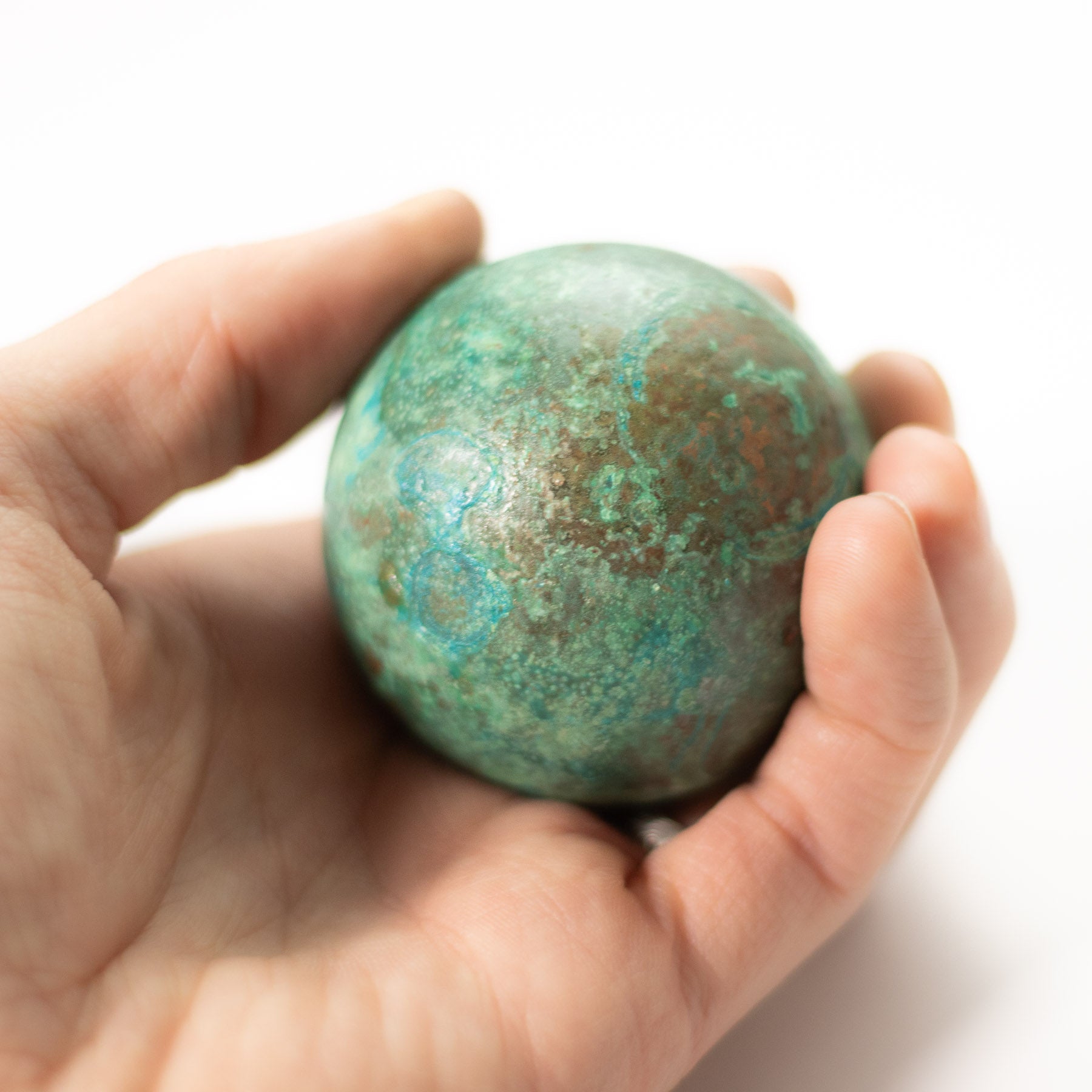 Verdigris cast copper orb by Shire Post Mint