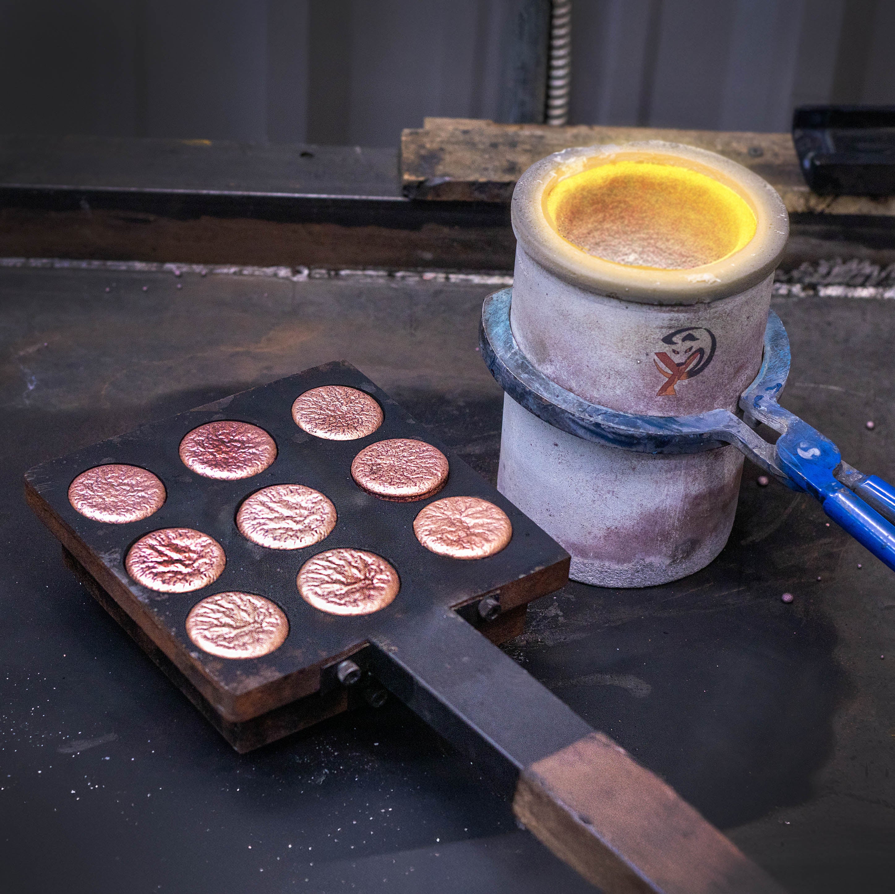 Freshly poured batch of Shire Post Mint Copper Hand Poured Worry Stone Fidget Puck