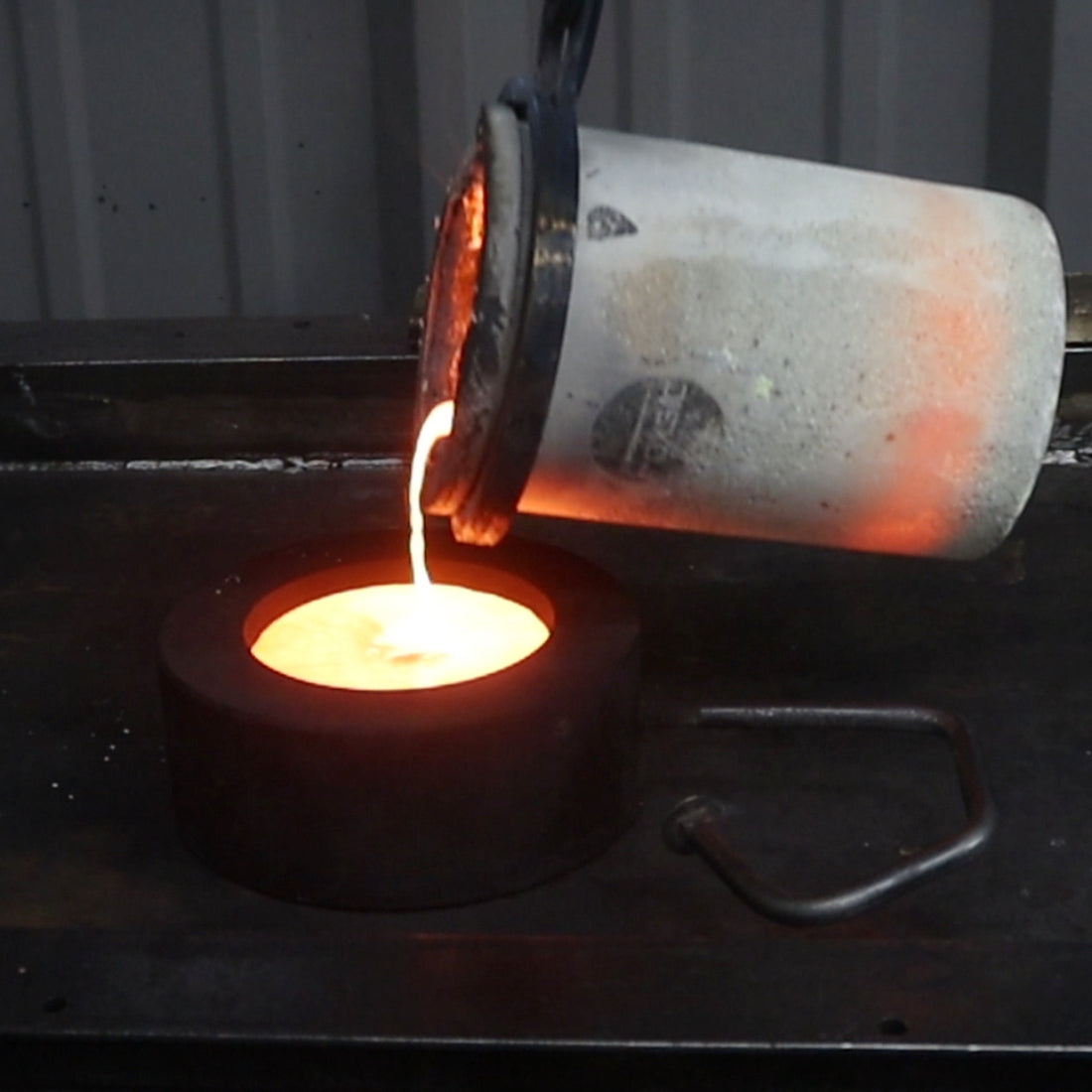 A bronze bowl being poured