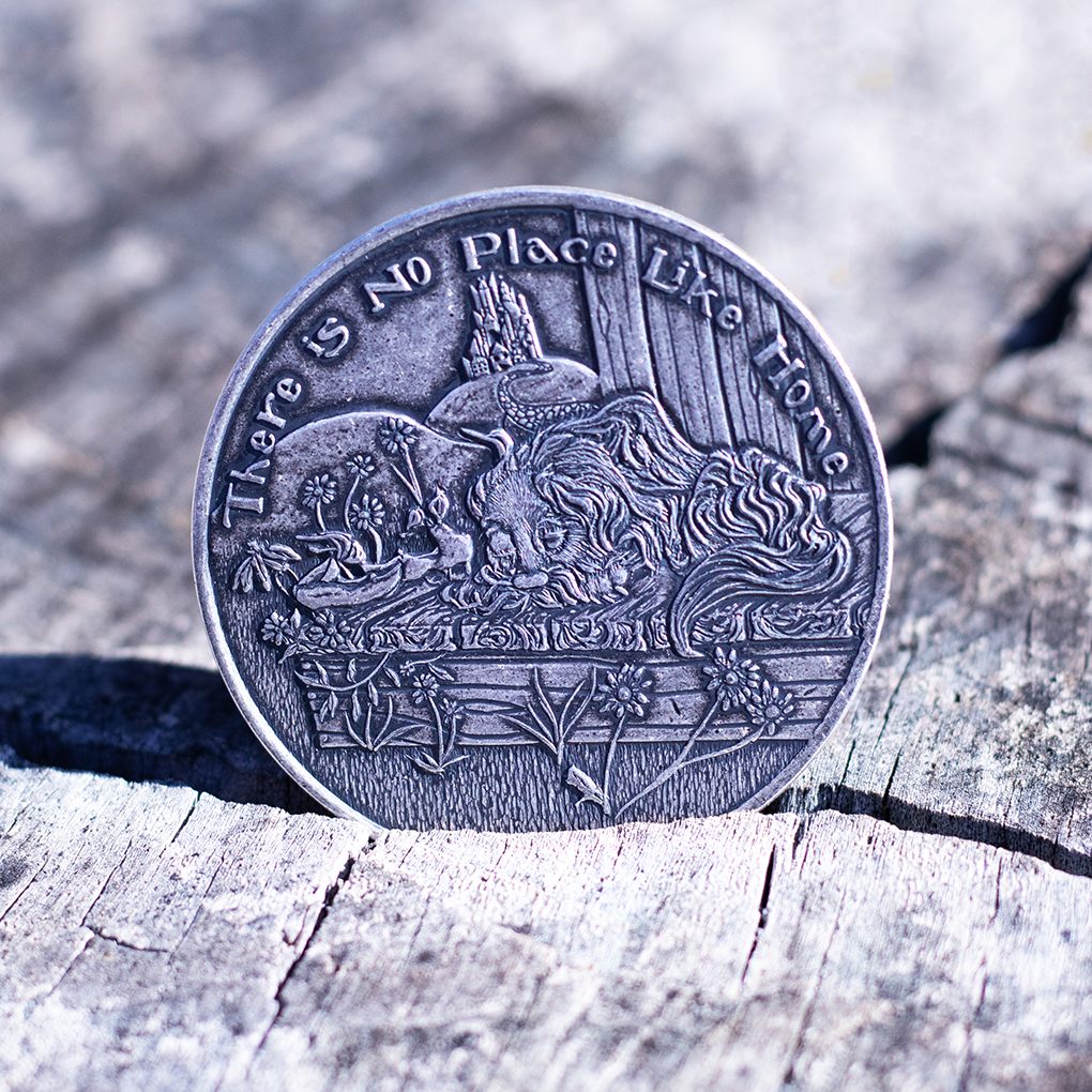 Fine silver coin with text, 'There is No Place Like Home' depicting a sleeping dog on a sunny porch, displayed resting in the crack of a wooden tree stump