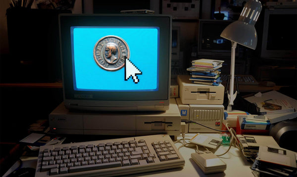 Old Amiga computer surrounded by old floppy disks with Robert Baratheon Star on glowing blue screen