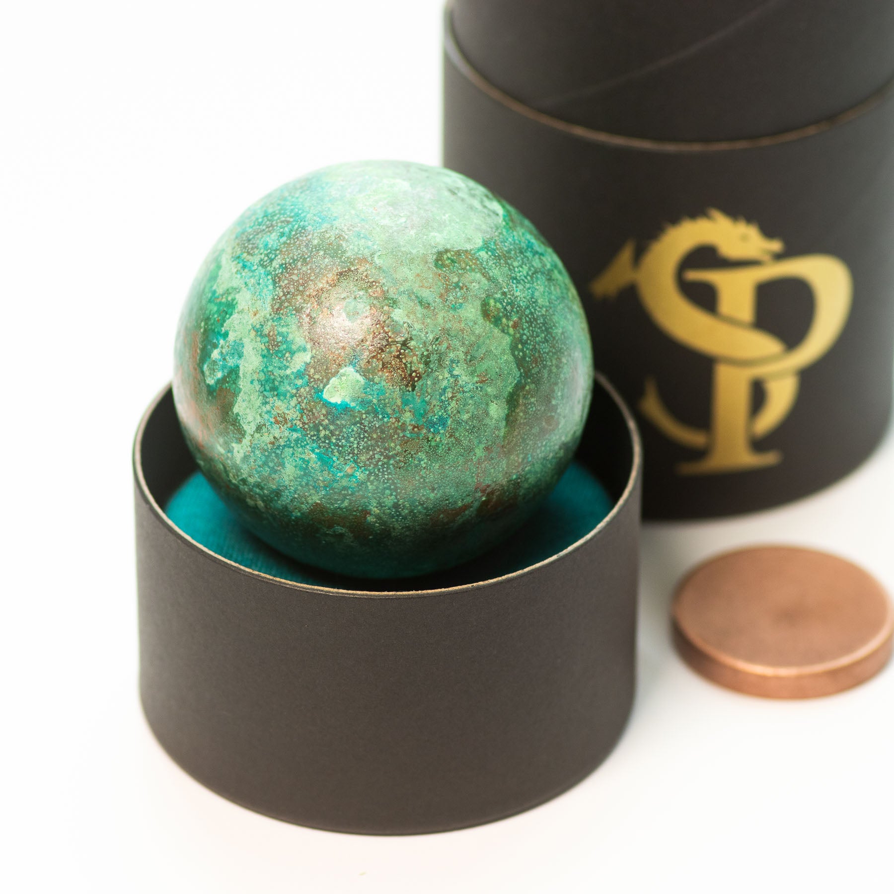 Verdigris cast copper orb by Shire Post Mint