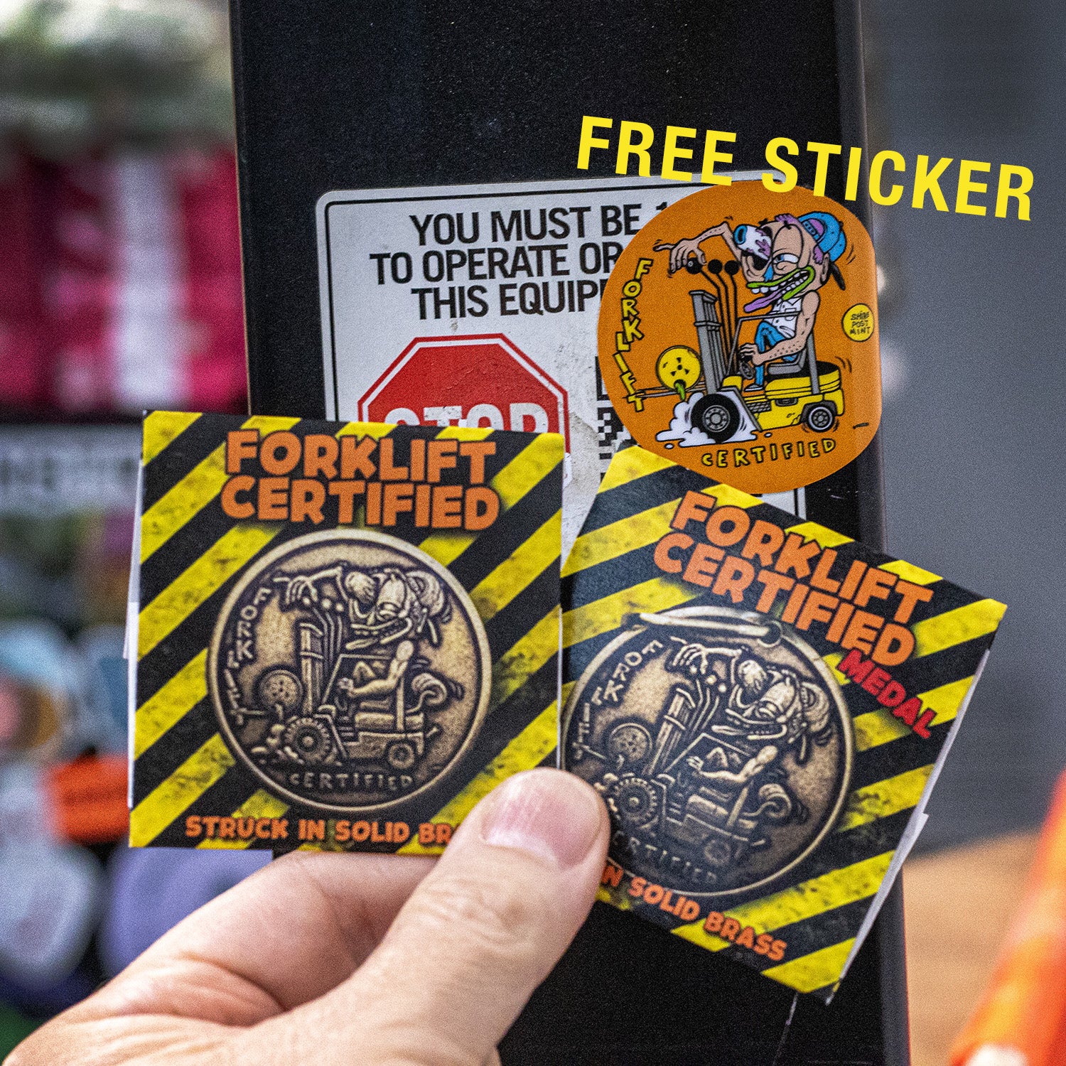 Hand holding Forklift Certified Coins packaged in folds 