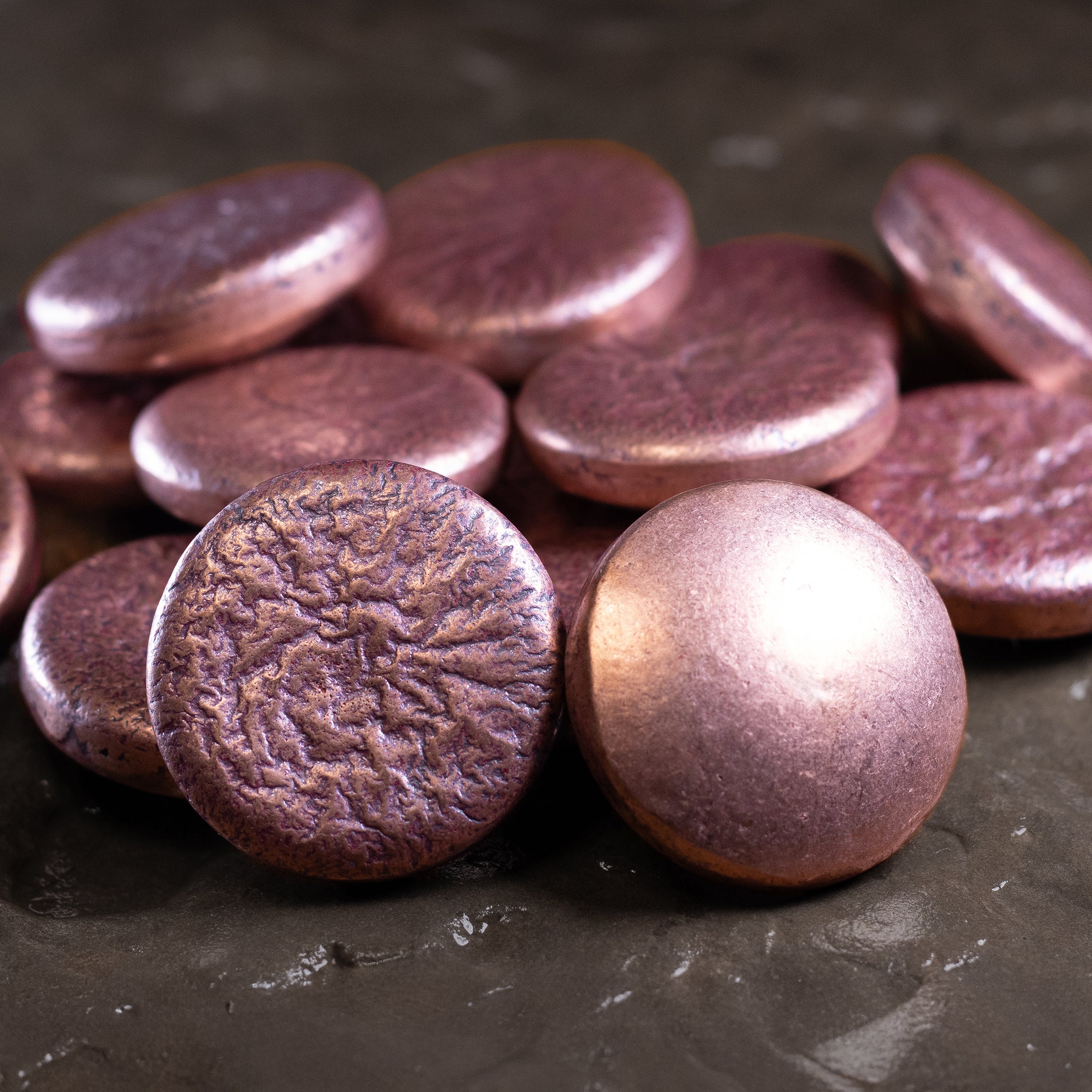Pile of Shire Post Mint Copper Hand Poured Worry Stone Fidget Pucks