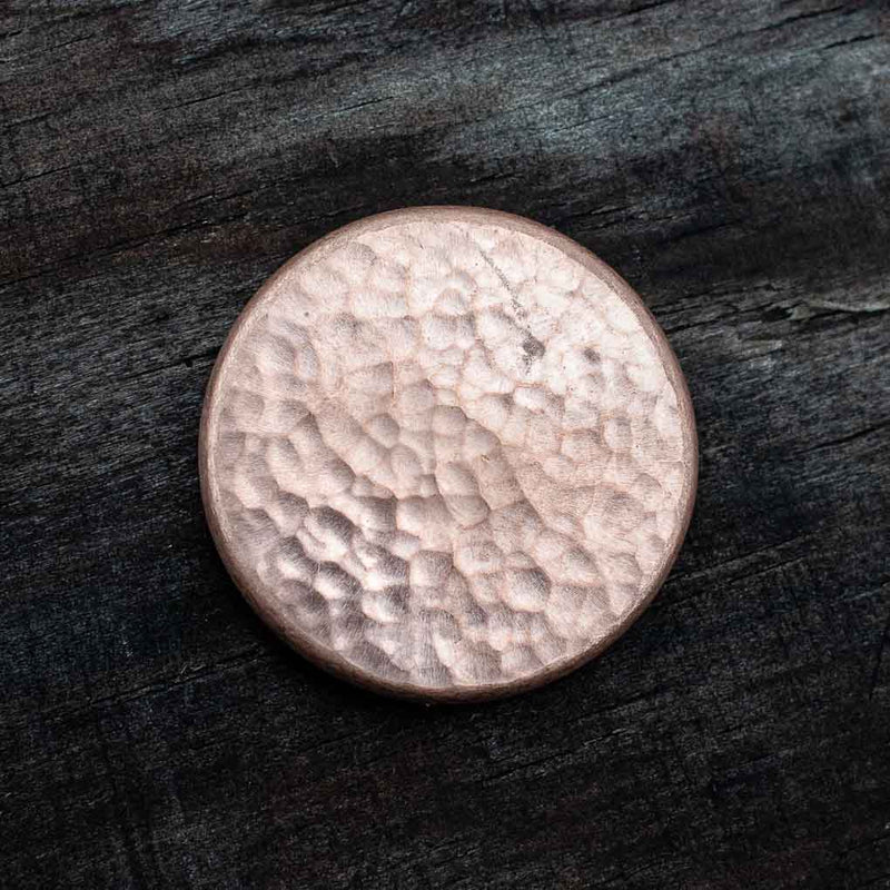 The raw hammered copper of the smoother of two sides Duplex Worry Stone - Raw Copper - Hammered and Textured Combo Coin | Shire Post Mint Gifts
